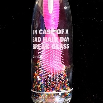 In case of bad hair day break glass emergency hair brush in a bottle