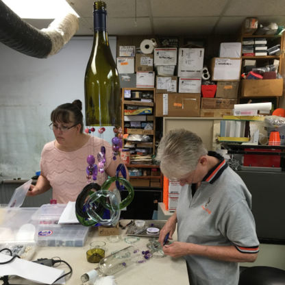 Wine bottle wind chime class students designing and laying out project
