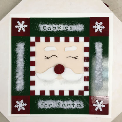 Fused santa cookie tray with snow frit before kiln firing