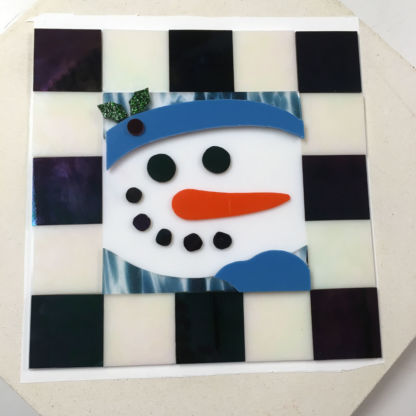 Fused snowman cookie tray before firing.