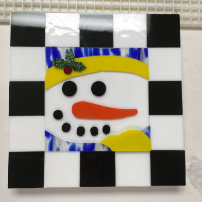 Student designed fused snowman cookie tray before firing