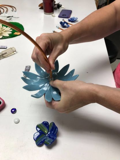 Student Assembling Fused flowers - Fused Flowers Class