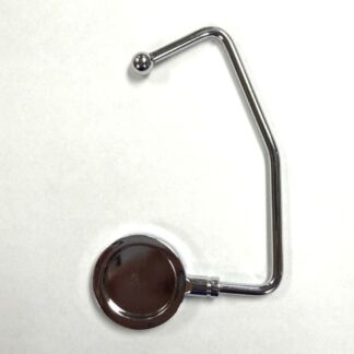 Chrome metal clamp-like tool: a curved bar with a round disc at the base on a white background