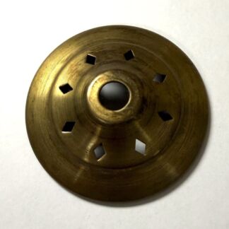 Brass circular floor drain cover with six diamond-shaped perforations around a central raised hub.
