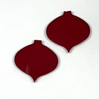 Two red onion-shaped cutouts with small stems on a white background