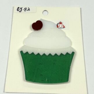 Decorative cupcake cutout: white swirled frosting with a red cherry on top and a green jagged-edged wrapper on a cream backing card