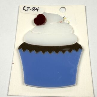 Cupcake illustration with a blue wrapper, white swirled frosting, and a red cherry on top on a white background, labeled CJ-84 on a small tag