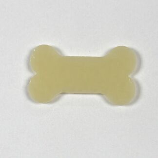 Bone-shaped pale yellow object on a white background (likely a dog treat or toy).