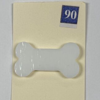 White bone-shaped sticker affixed to a pale yellow folder, with a blue 90 label in the corner.
