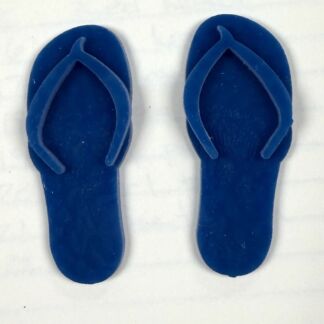 Pair of blue flip-flops placed side by side on a white surface.