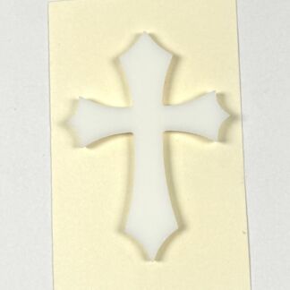 White cross-shaped cutout centered on a pale yellow sticky note background