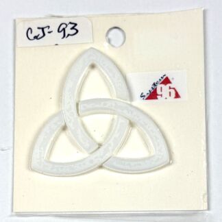 White Celtic triquetra pin on a cream backing with a small price sticker reading 96 and a handwritten code CJ-93