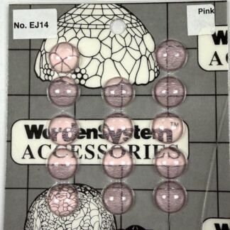 Row of pink marbled beads strung in a chain, laid over a packaging card reading 'Accessories'.
