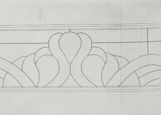 Long decorative horizontal border featuring symmetrical scrollwork within a rectangular frame.