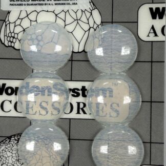 Six translucent glass marbles arranged in two vertical columns on a grid background with a vintage label reading 'No. 25 - White Jewels Made in Germany'